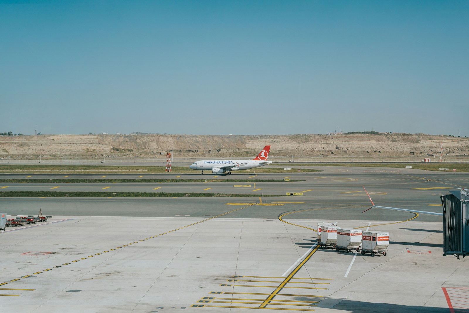 Commercial airplane parked on airport tarmac
